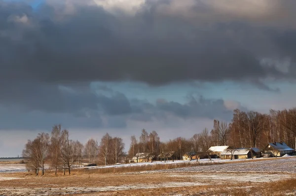 Clouds gather over the village — Stock Photo, Image