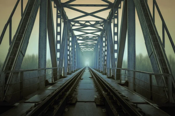 Railroad track during autumn foggy morning in countryside — Stock Photo, Image