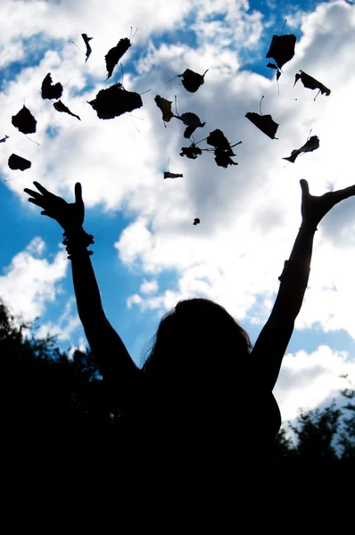 Silhouette of an happy woman at forest background — Stock Photo, Image