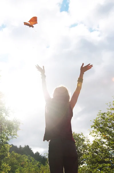 Silhouette of an happy woman at forest background