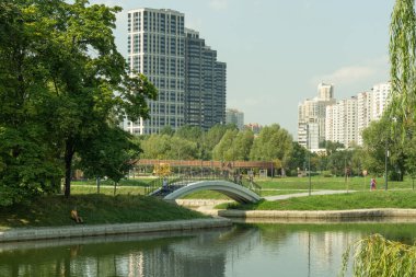 Cityscape of Moscow, exurbia near the park, a combination of urban and nature in Moscow. Green park Druzhba near metro station Rechnoy Vokzal, 09 August 2021