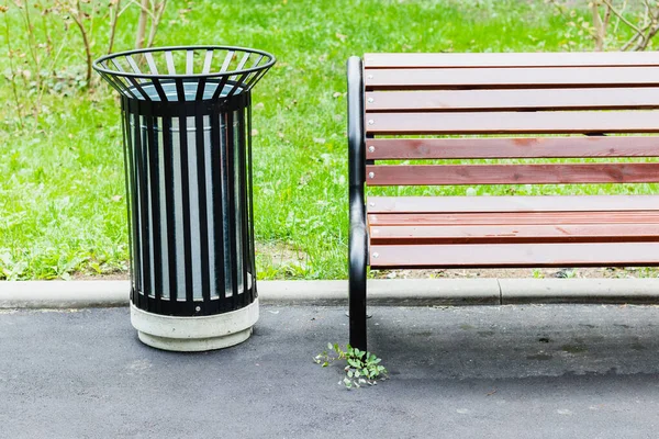 The city\'s new garbage cans and wooden bench in public places and parks.