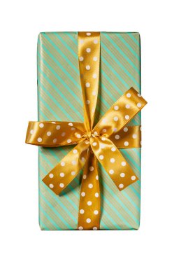 Isolated Christmas gift box wrapped in green striped paper with gold polka dot ribbon