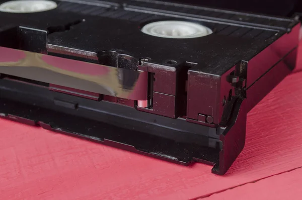 The cartridge for the tape recorder on a wooden table — Stock Photo, Image