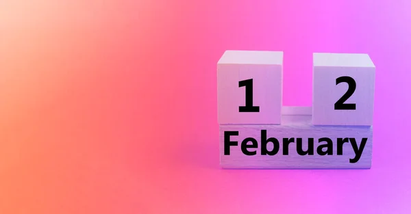 February 12th. Image of Feb 12 wooden color calendar on white canvas background. empty space for text — Stock Photo, Image