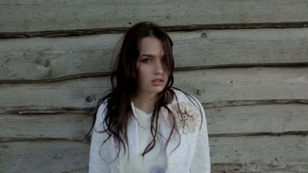 Young woman Near Wooden House — Stock Video