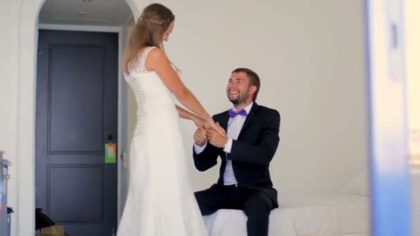 Happy newlyweds sitting in their hotel on honeymoon. Greece — Stock Video