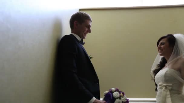 Happy bride and groom in the lobby of the restaurant — Stock Video