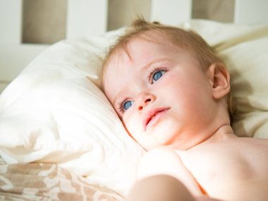 beautiful blue-eyed girl with pensive face