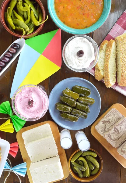 Fasting food for Clean Monday and a kite on wooden table