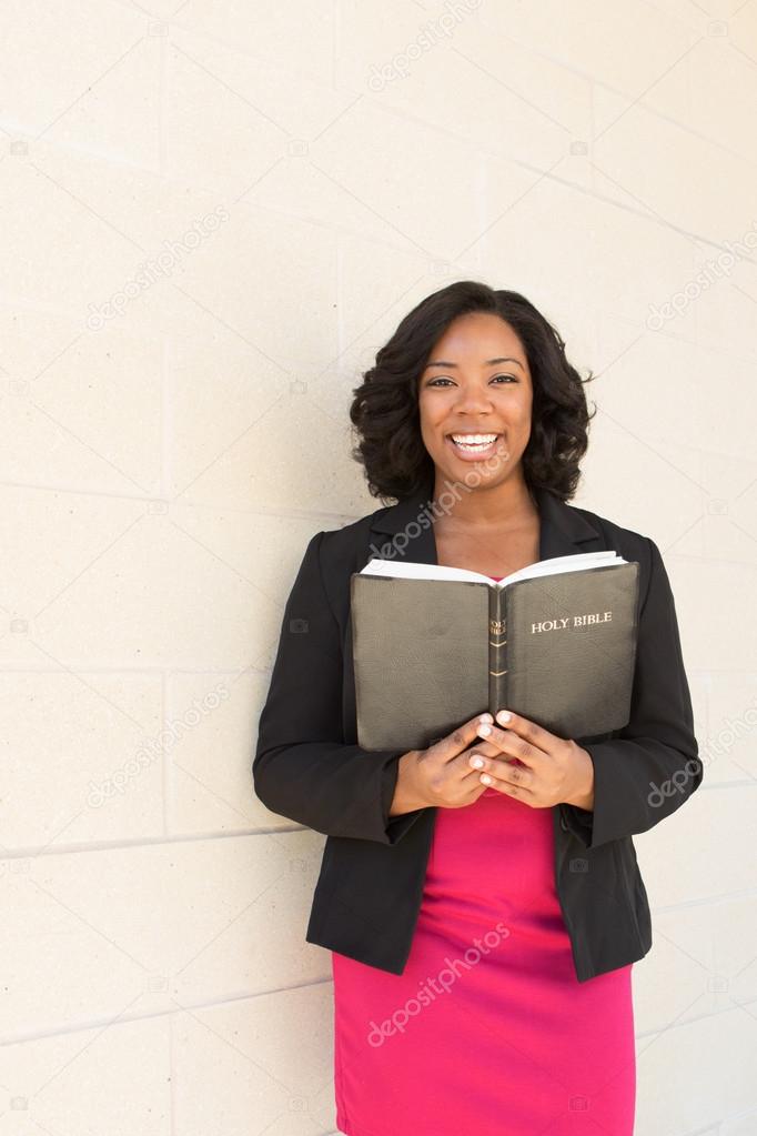African American woman holding a Bible