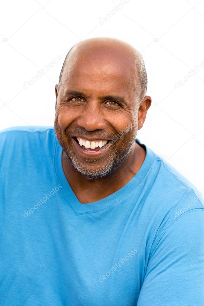 Mature African American man smiling isolated on white.