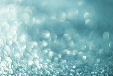 Damlalardan gelen parlak mavi bokeh, soyutlama, şenlik arka planı