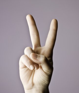 Man hand indicating peace victory sign clipart