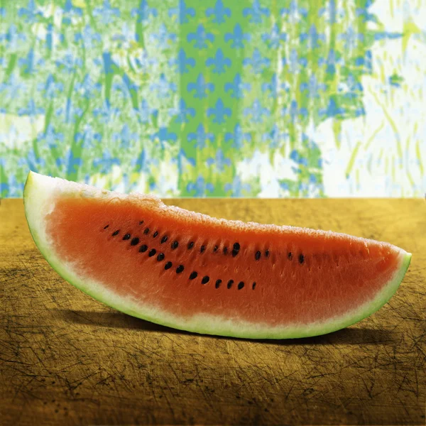 A slice of juicy watermelon on a wooden board — Stock Photo, Image