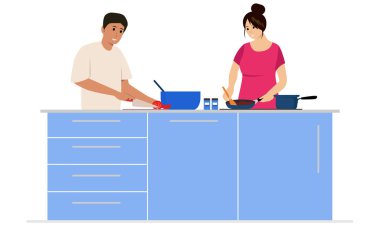 Excited happy beautiful young couple in love cooking in the kitchen and having fun together while making fresh healthy vegan salad. Family of two preparing food. Couple making delicious fresh salad.