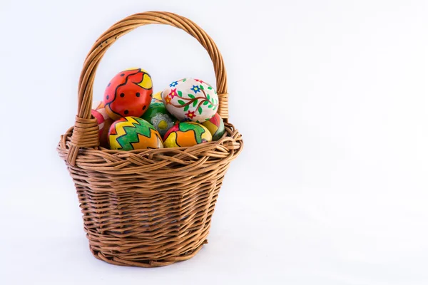 Painted eggs in basket — Stock Photo, Image