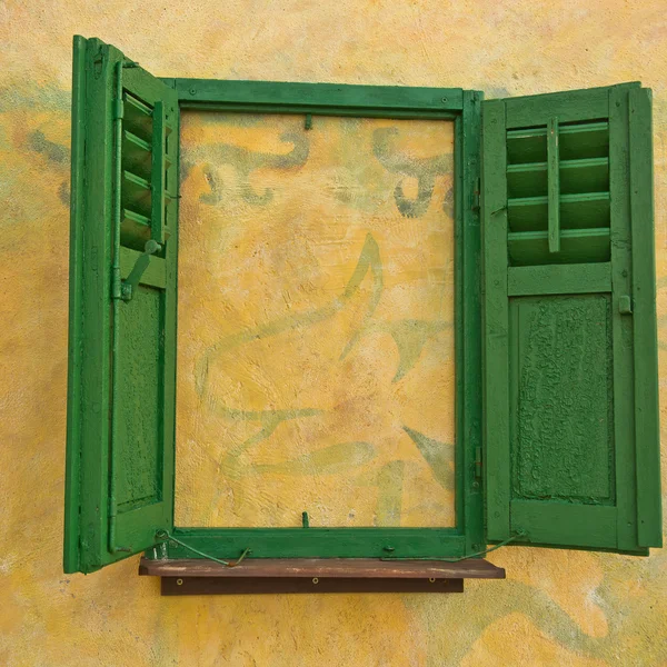 Walled window with green shutters — Stock Photo, Image