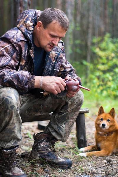 Hunter plucks a fowl — Stock Image Hunter plucks a fowl Royalty Free Stock Photos