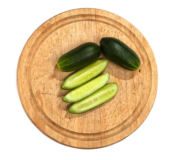 Cucumbers on wooden cutting board — Stock Photo, Image