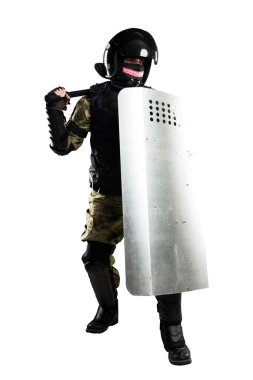 Zırhlı, coplu, koruyucu kalkanlı askerler. Üniforma, Polis Özel Amaçlı Mobil Birimi 'ne (rosgvardia) uyuyor. Kabalığı Rusça Rosgvardia yazısıyla yamayın.. 