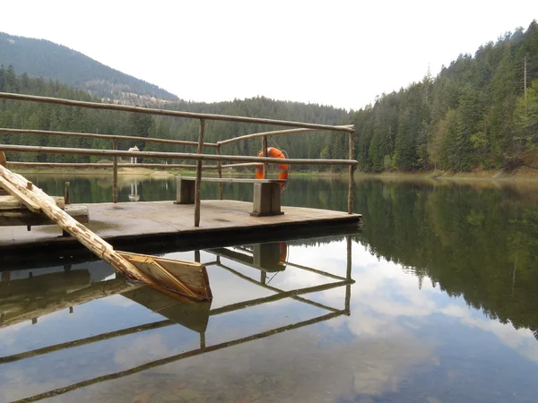 pier at the lake in the mountains