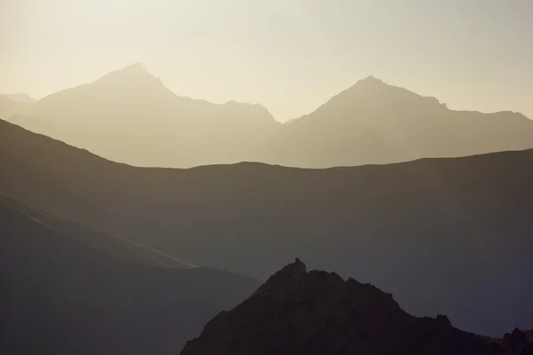 Background layered mountains at sunset — Stock Photo, Image