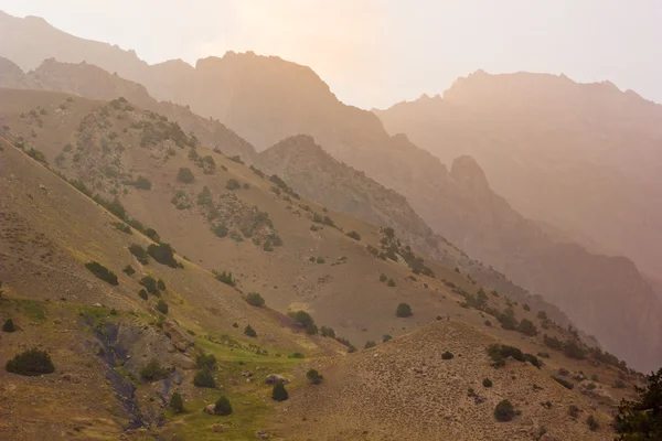 Background layered mountain hills at sunset — Stock Photo, Image