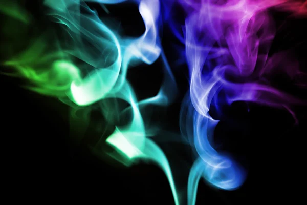 Colored smoke on a black background — Stock Photo, Image