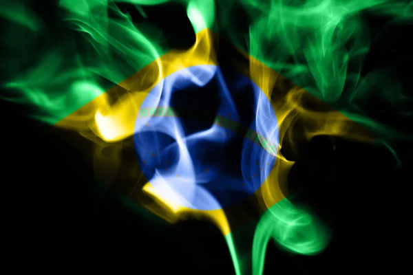 Colored smoke on a black background with brazilian flag — Stock Photo, Image