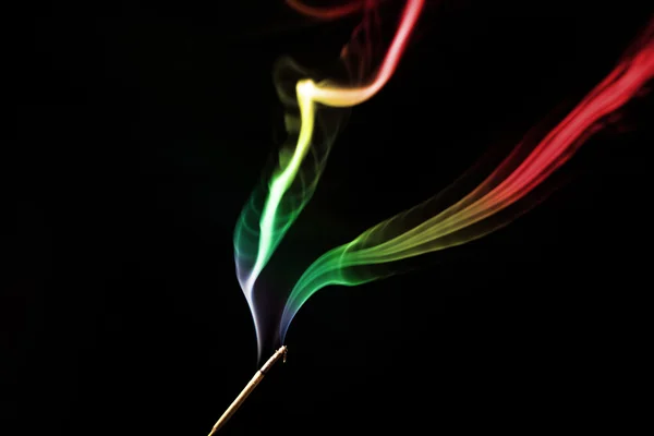 Colored smoke on a black background — Stock Photo, Image