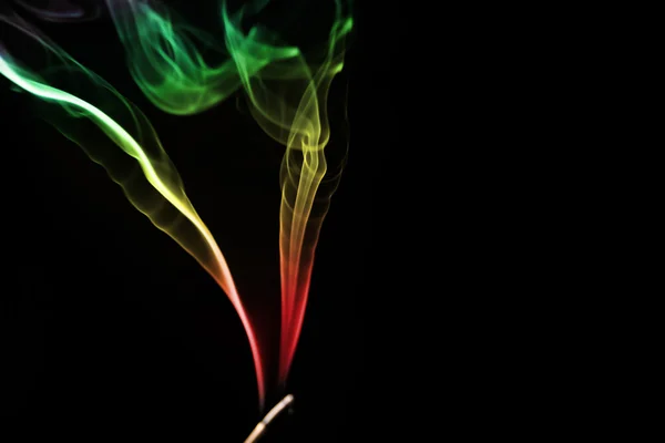 Colored smoke on a black background — Stock Photo, Image