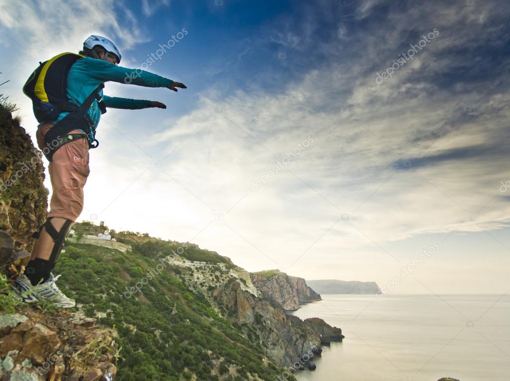 base-jumper jumps from the cliff