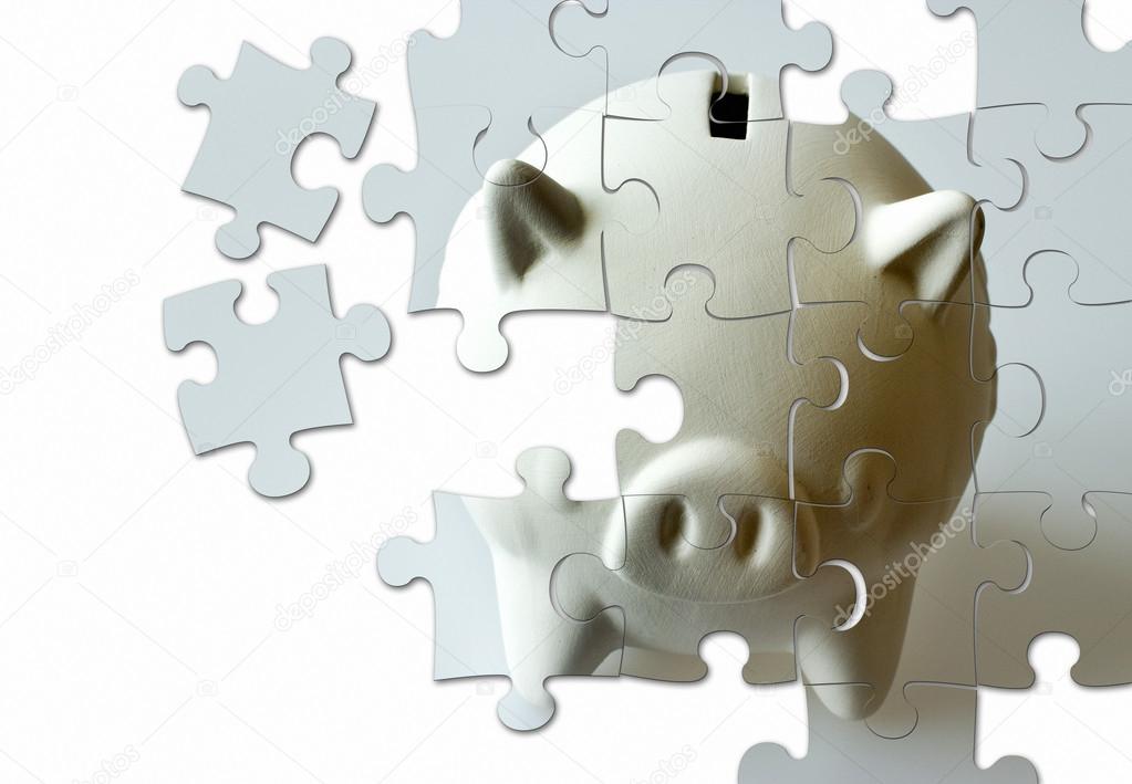 piggy bank made of puzzle - economy and finance