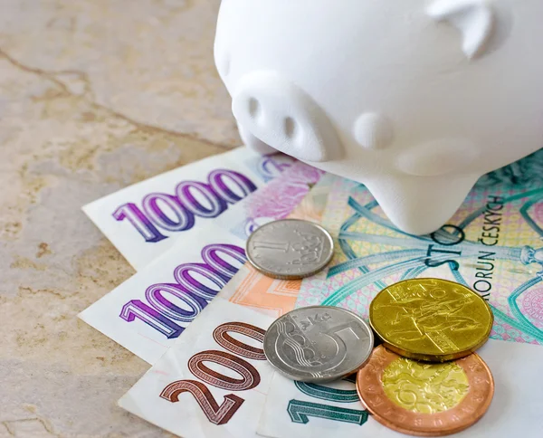 Czech crown banknotes and coins with piggy bank — Stock Photo, Image