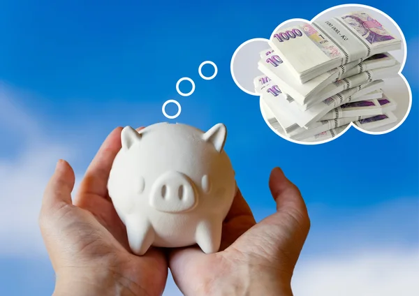 Piggy bank with dream of pile of money — Stock Photo, Image