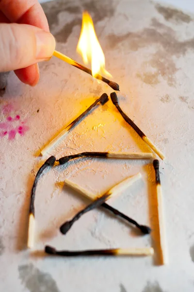 Burnt out family house after fire made of used matches — Stock Image Burnt out family house after fire made of used matches Stock Image
