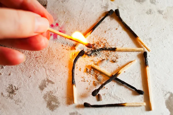 Burnt out family house after fire made of used matches — Stock Image Burnt out family house after fire made of used matches Stock Photo