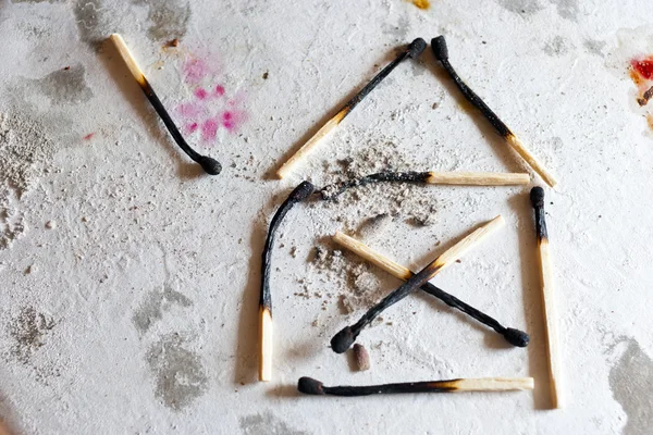 Burnt out family house after fire made of used matches — Stock Image Burnt out family house after fire made of used matches Royalty Free Stock Photos