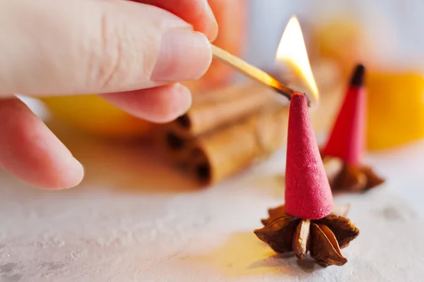 Traditional Czech christmas - smoking incense cones on star anise spice with whole cinnamon and apple — Stock Photo, Image