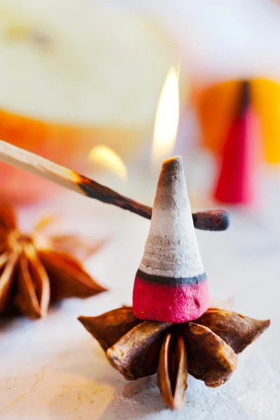 Traditional Czech christmas - smoking incense cones on star anise spice with whole cinnamon and apple — Stock Photo, Image