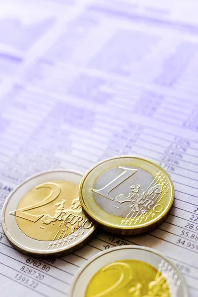 Euro coins and bursa news in the newspaper — Stock Photo, Image