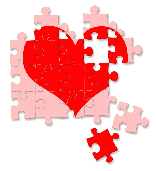 Rode gebroken hart gemaakt door puzzelstukjes — Stockfoto