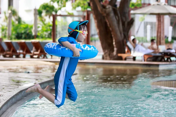 Little asian boy jump to the pool — Stock Photo, Image