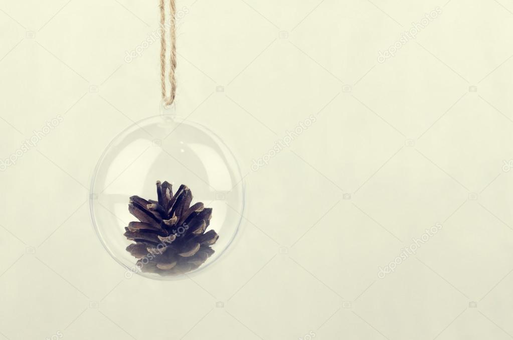 Transparent Christmas ball with a pine cone inside