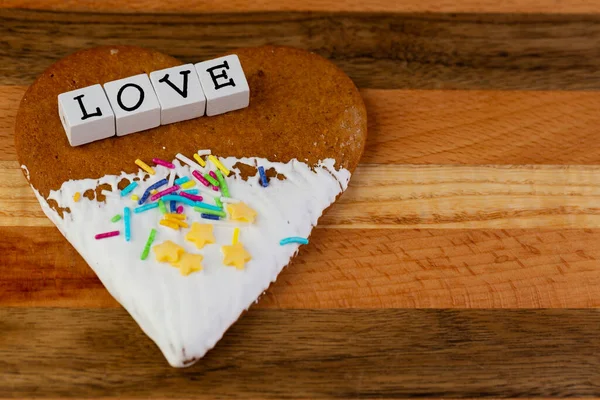 Composition Glazed Gingerbreads Shape Hearts Word Love Arranged Wooden Board — Stock Photo, Image