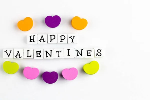 Happy Valentines Text Arranged Wooden Blocks White Background Accompanied Colorful — Stock Photo, Image