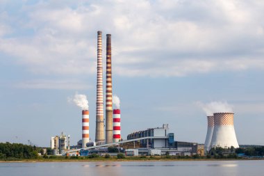 Distant view of the coal-fired power plant. Photo taken on a sunny day with good lighting conditions. clipart