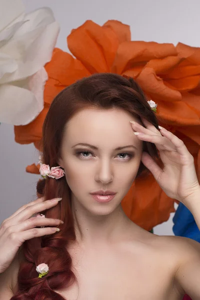 Beautiful girl with flowers in her hair — Stock Photo, Image