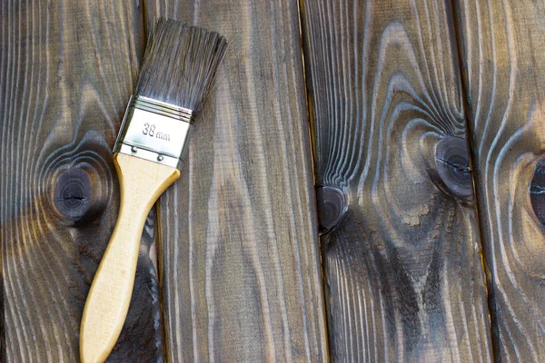 Latar belakang tekstur kayu dan kuas pekerjaan rumah tangga — Stok Foto